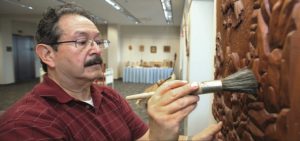 Dr. Leonard G. Trujillo working on a relief carving.