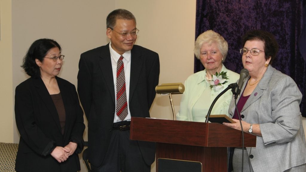 Photo of Dr. Yuandong Ji, Dr. Chunguang Li, Mrs. Laupus, and Dr. Spencer during the dedication ceremony for the Evelyn Fike Laupus Portrait and Gallery