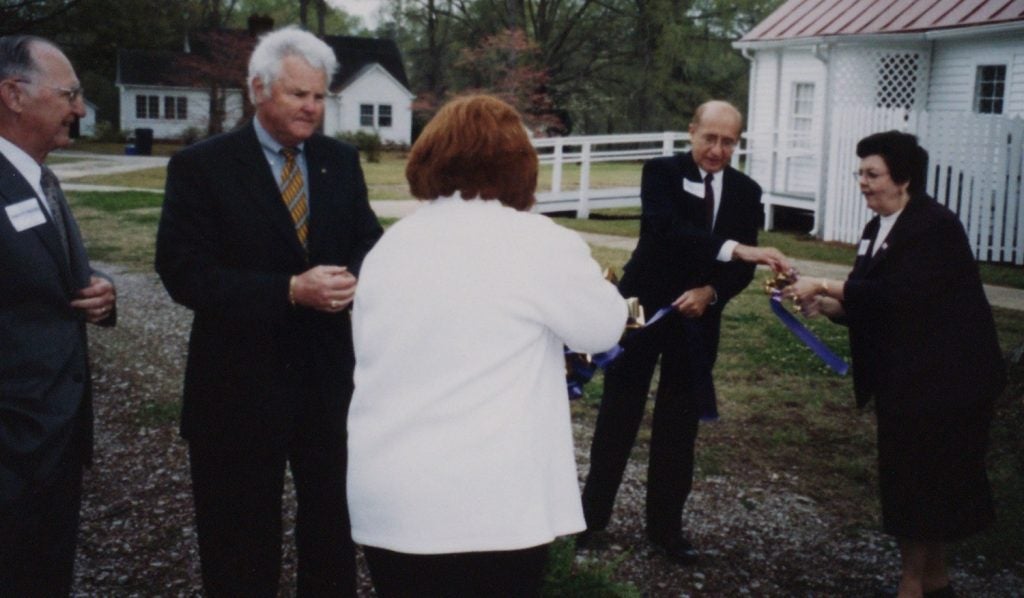 Photo of the ribbon cutting for the rededication of the Country Doctor Museum
